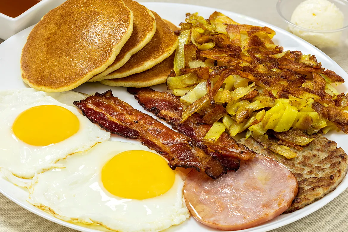 Jacob's Slammin' Platter — two sunny eggs, bacon, Canadian bacon, a sausage patty, hash browns and silver dollar pancakes